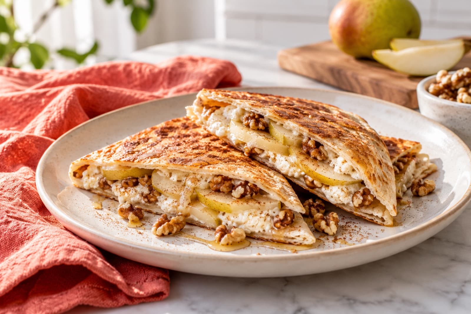Photographic illustration of pear walnut breakfast quesadilla